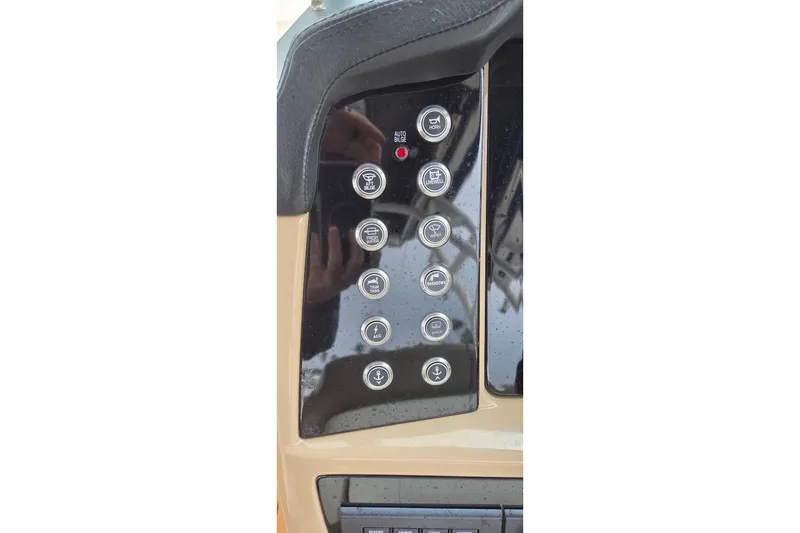 Slide: The Image of 2023 Robalo R317 Dual Console boat interior with modern dashboard and steering wheel. - 21