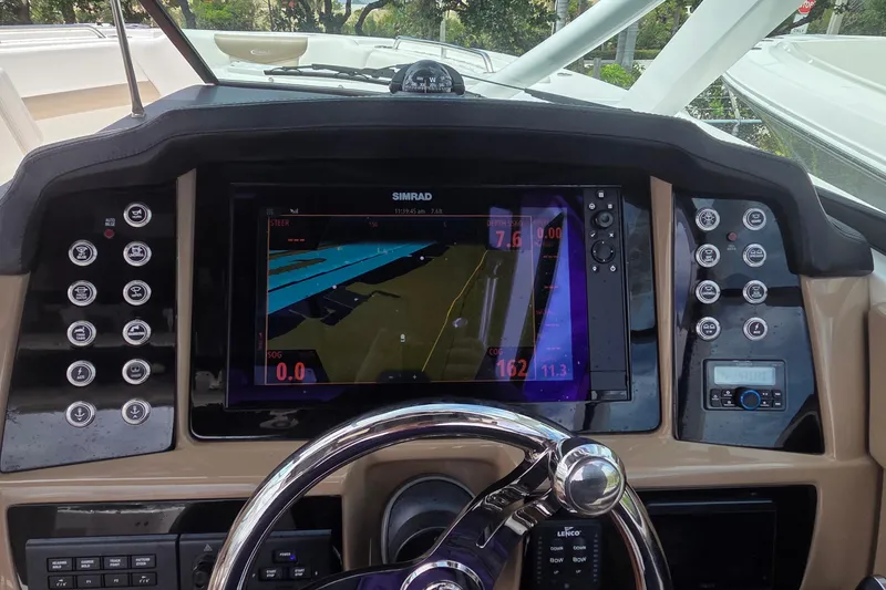 Slide: The Image of Control panel of 2023 Robalo R317 Dual Console boat with various function buttons. - 24