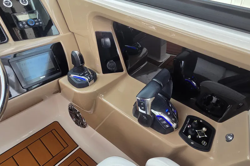 Slide: The Image of 2023 Robalo R317 Dual Console boat's sleek black hardtop with integrated lighting. - 25