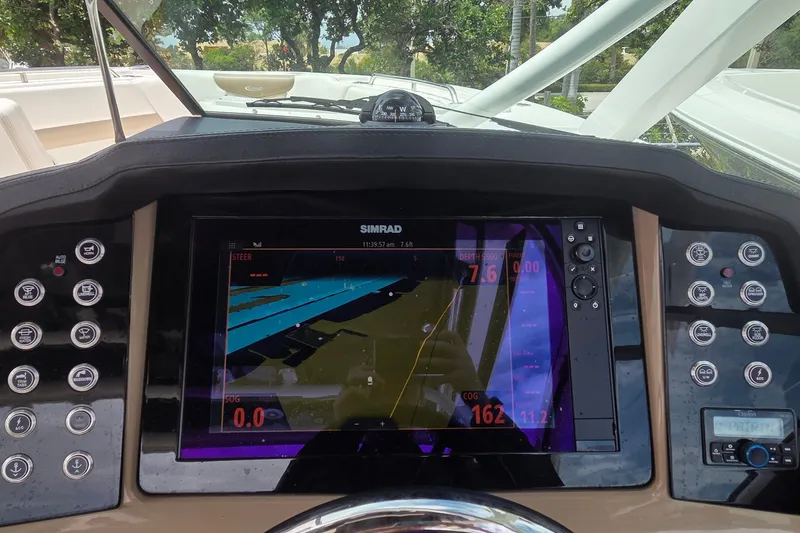 Slide: The Image of 2023 Robalo R317 Dual Console boat cockpit with modern steering and controls. - 26