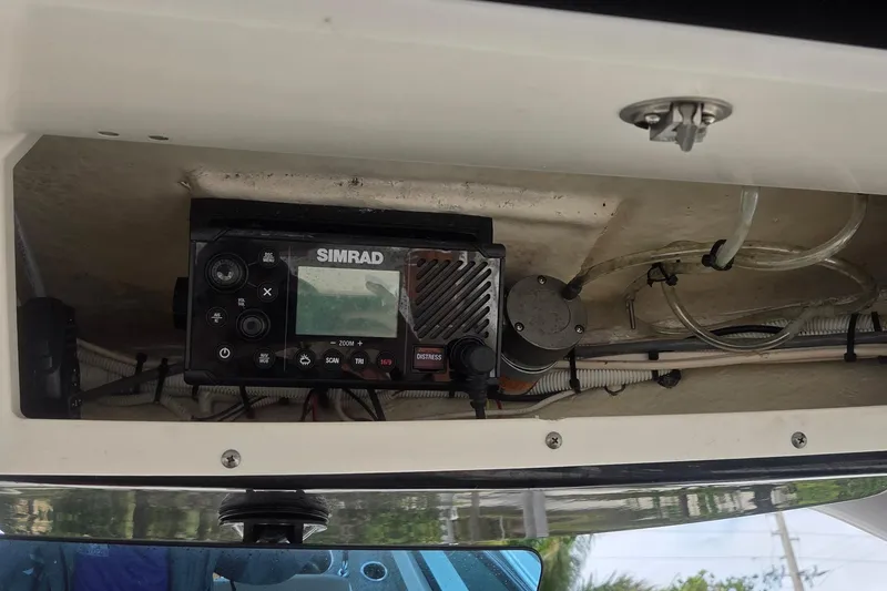 Slide: The Image of Control panel of 2023 Robalo R317 Dual Console boat with power switches and indicators. - 31