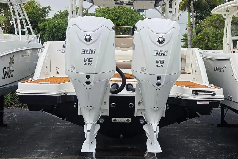 Slide: The Image of 2023 Robalo R317 Dual Console with twin Yamaha 300 V6 outboard engines. - 4