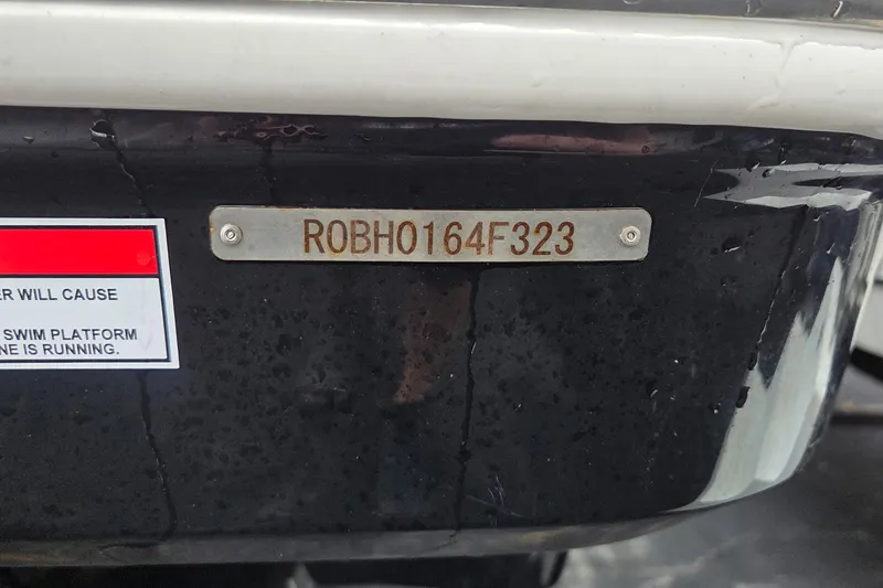Slide: The Image of 2023 Robalo R317 Dual Console boat with identification plate "ROBH0164F323". - 6