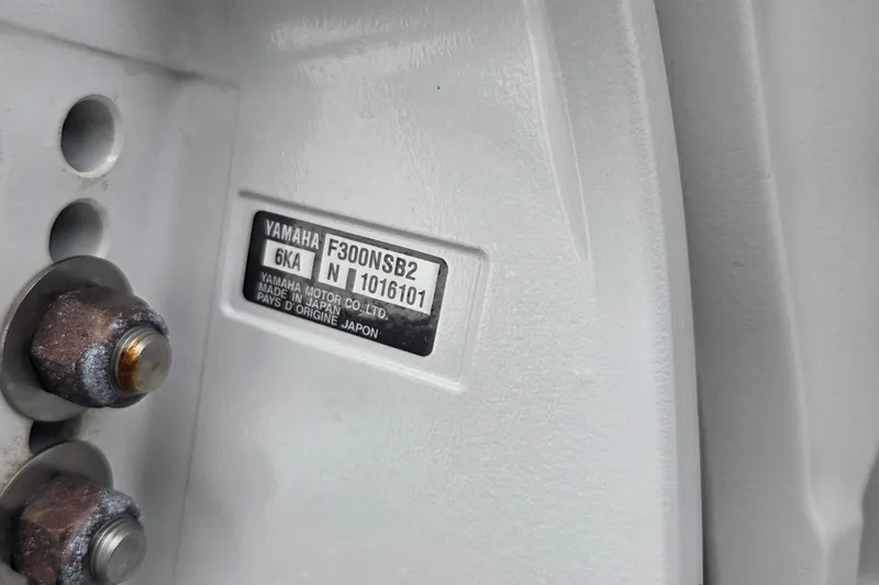 Slide: The Image of Yamaha engine label on 2023 Robalo R317 Dual Console boat, showing model and serial number. - 7