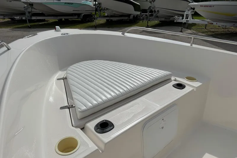 Slide: The Image of 2004 Sea Hunt Triton 186 boat interior with cushioned seating and storage compartments. - 12