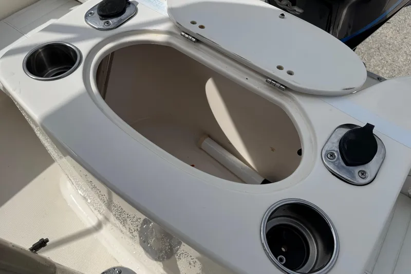 Slide: The Image of Open storage compartment on a 2004 Sea Hunt Triton 186 boat. - 14