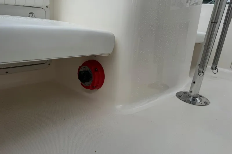 Slide: The Image of 2004 Sea Hunt Triton 186 boat interior with seating and red control knob. - 19