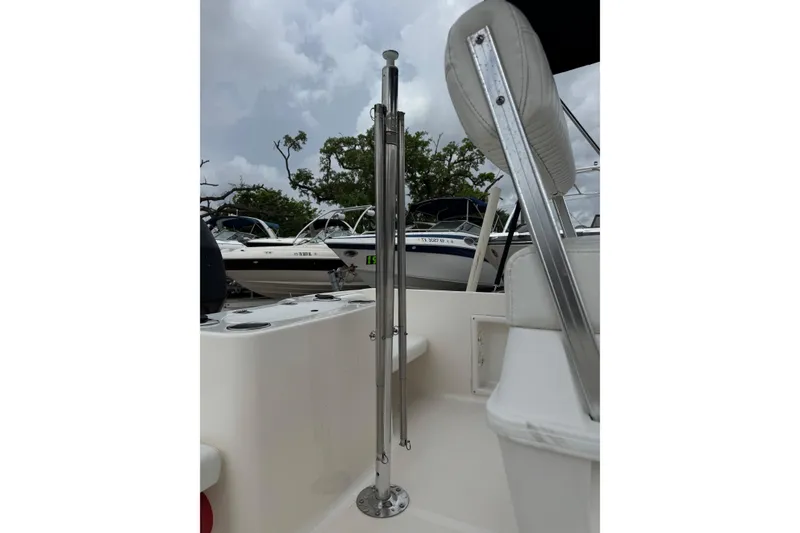 Slide: The Image of 2004 Sea Hunt Triton 186 boat interior with stainless steel fittings and seating. - 9