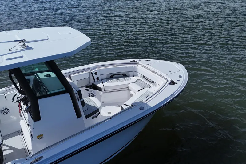 Slide: The Image of 2025 Blackfin 252 CC boat on water, showcasing sleek design and spacious seating. - 10