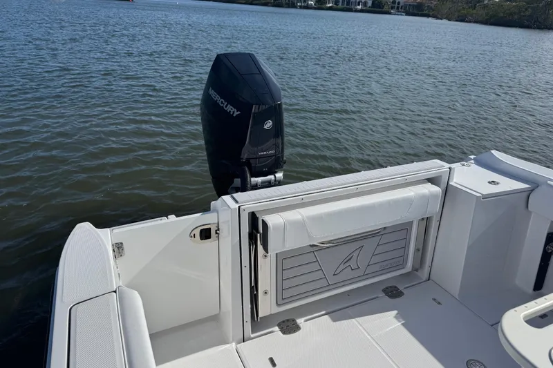 Slide: The Image of 2025 Blackfin 252 CC boat with Mercury engine on calm water. - 16