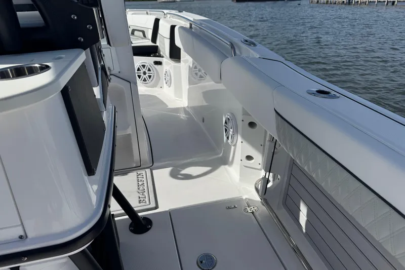 Slide: The Image of Interior view of 2025 Blackfin 252 CC boat, showcasing sleek design and spacious seating. - 19