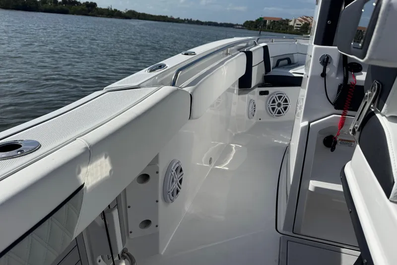 Slide: The Image of 2025 Blackfin 252 CC boat interior with sleek design and modern features on the water. - 21