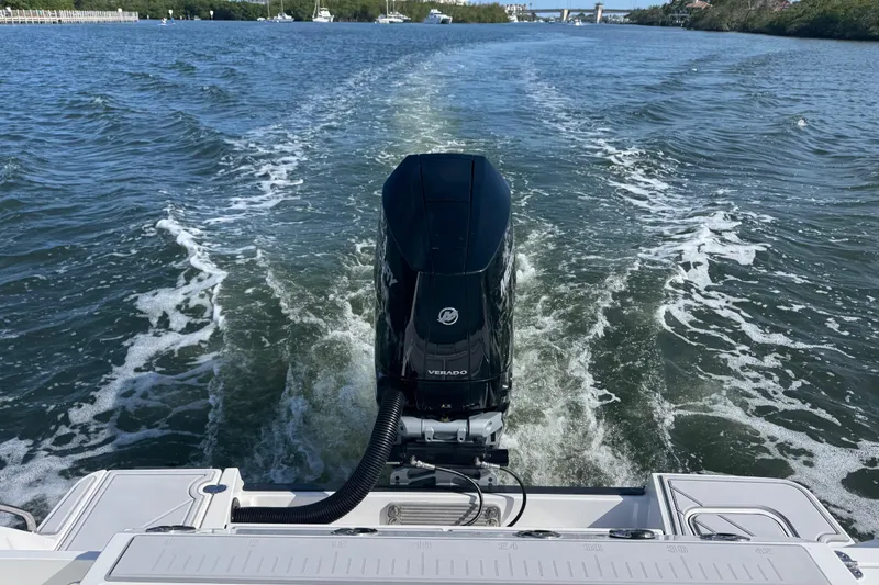 Slide: The Image of 2025 Blackfin 252 CC boat cruising on a scenic waterway. - 38