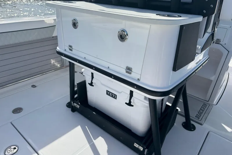 Slide: The Image of 2025 Blackfin 252 CC boat deck with Yeti cooler storage. - 39