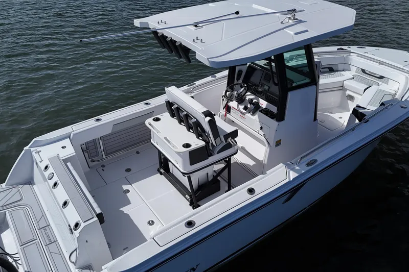 Slide: The Image of 2025 Blackfin 252 CC boat with spacious deck and modern console on water. - 9