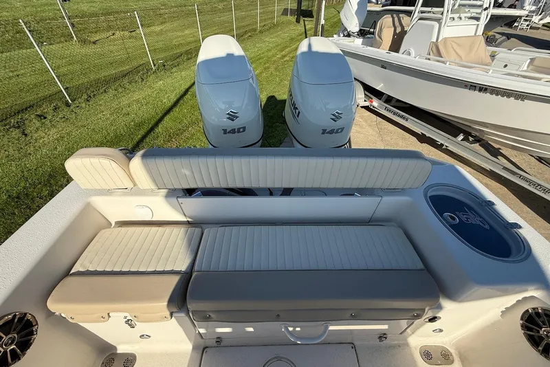 Slide: The Image of 2019 Sea Chaser 24 HFC boat with dual Suzuki 140 engines and cushioned seating. - 11