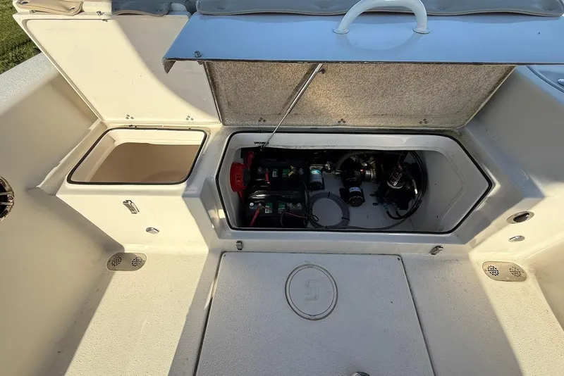 Slide: The Image of 2019 Sea Chaser 24 HFC boat storage compartments and battery area. - 12