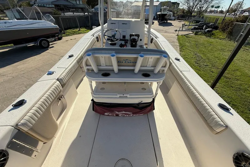 Slide: The Image of 2019 Sea Chaser 24 HFC boat interior with helm, seating, and storage compartments. - 13