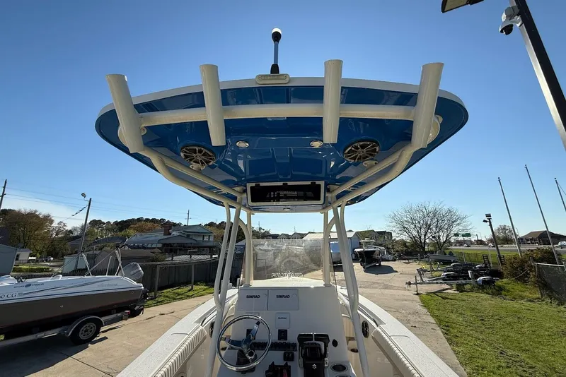 Slide: The Image of 2019 Sea Chaser 24 HFC boat with blue T-top and steering console. - 16