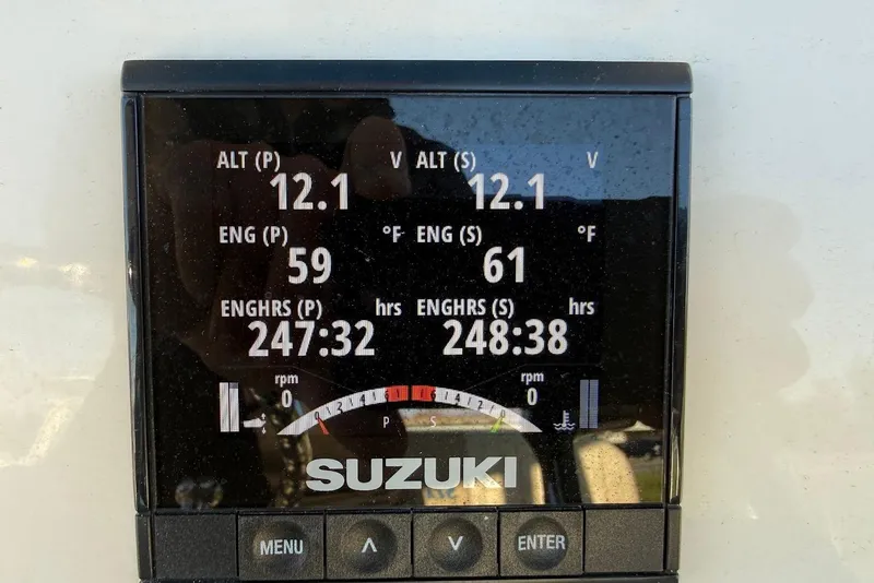 Slide: The Image of Suzuki engine display on 2019 Sea Chaser 24 HFC showing voltage and engine hours. - 21