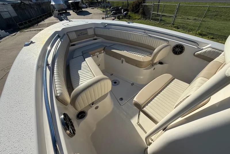Slide: The Image of 2019 Sea Chaser 24 HFC boat interior with beige seating and stainless steel accents. - 22