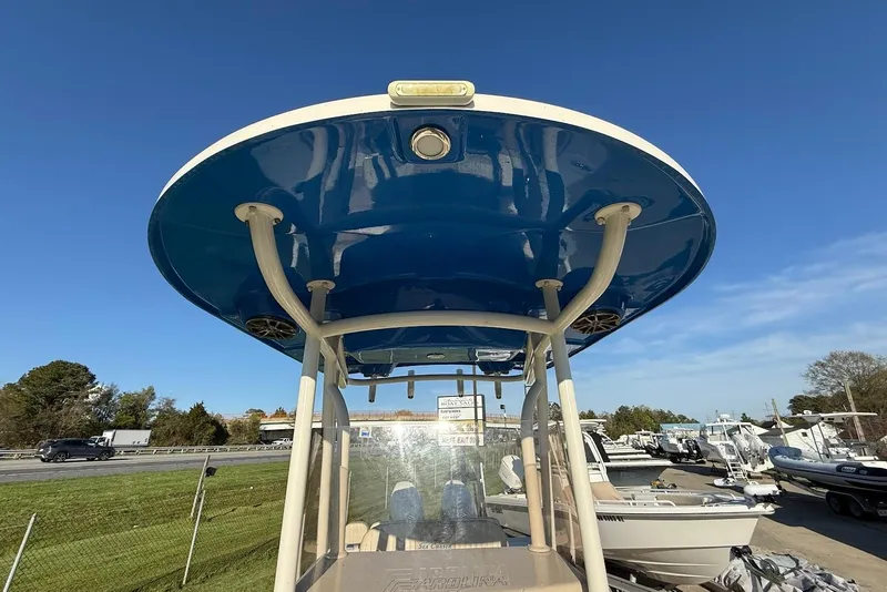 Slide: The Image of 2019 Sea Chaser 24 HFC boat with blue T-top under clear sky. - 24