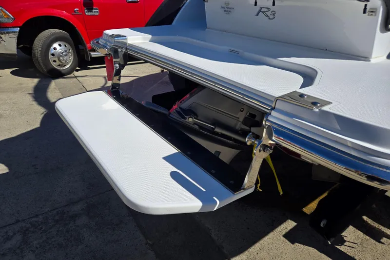 Slide: The Image of 2016 Cobalt R3 boat with extended swim platform in a sunny outdoor setting. - 12