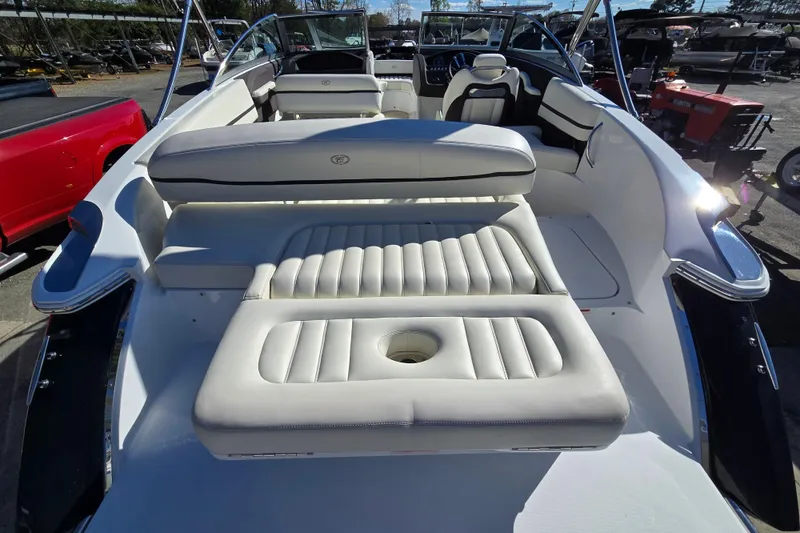 Slide: The Image of 2016 Cobalt R3 boat interior with white leather seating and sleek design. - 14
