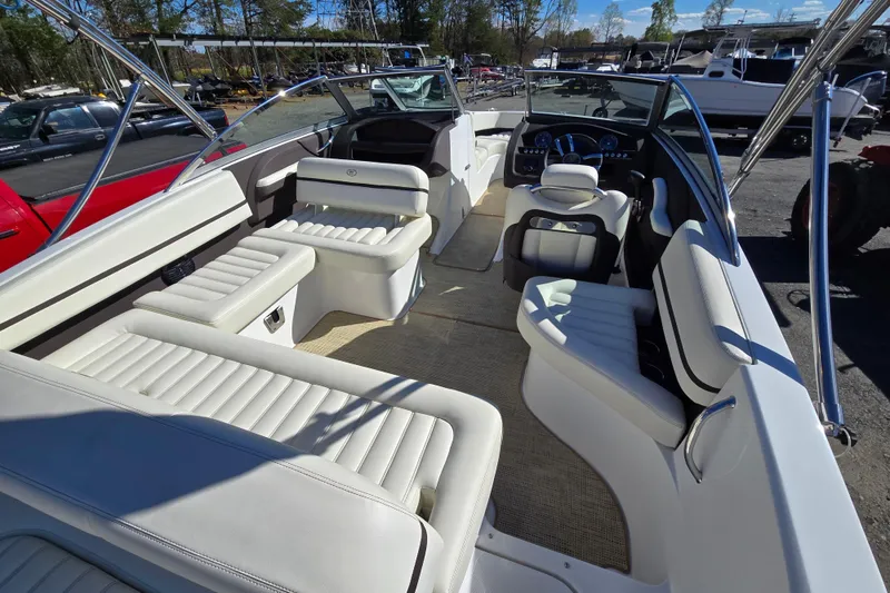 Slide: The Image of 2016 Cobalt R3 boat interior with white seating and modern dashboard. - 15