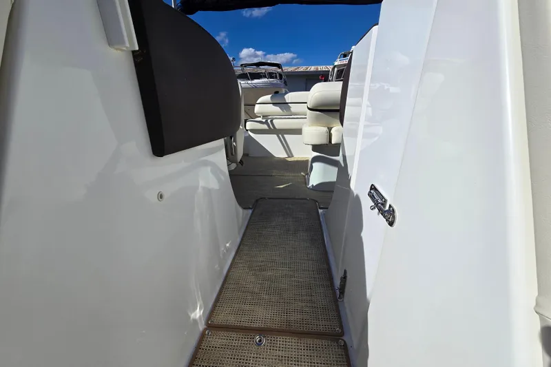 Slide: The Image of Interior view of a 2016 Cobalt R3 boat, featuring seating and a walkway. - 18