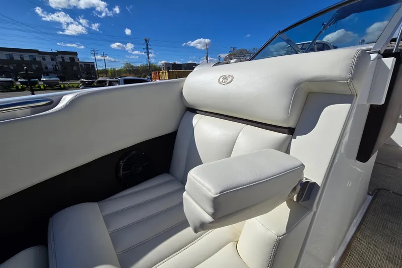 Slide: The Image of Luxurious white seating in a 2016 Cobalt R3 boat under a clear blue sky. - 19