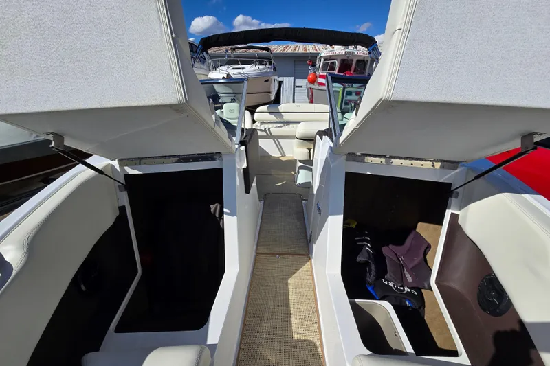 Slide: The Image of 2016 Cobalt R3 boat interior with open storage compartments and seating. - 23