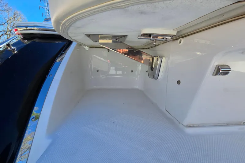 Slide: The Image of Interior view of a 2016 Cobalt R3 boat storage compartment with stainless steel hardware. - 29