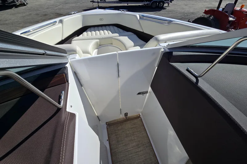 Slide: The Image of 2016 Cobalt R3 boat interior with white seating and open deck view. - 31