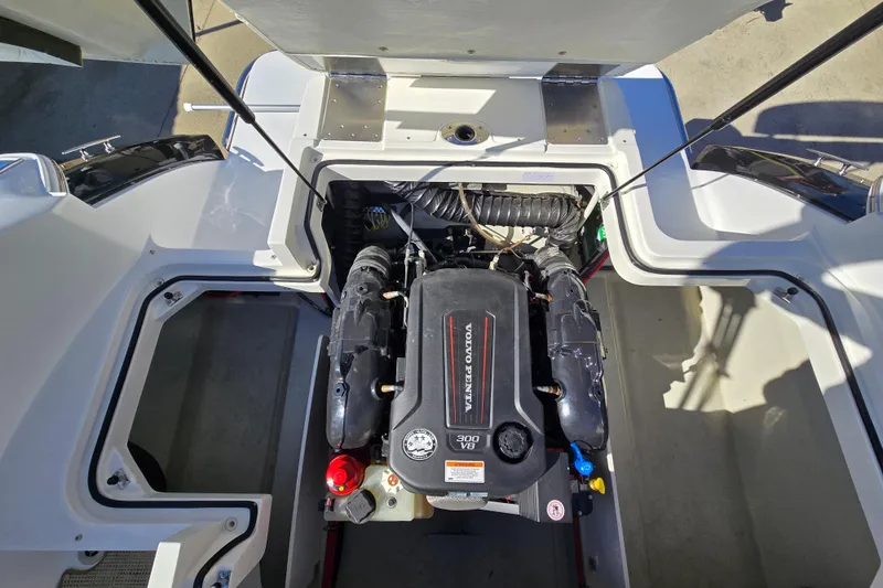 Slide: The Image of Engine compartment of a 2016 Cobalt R3 boat featuring a Volvo Penta 300 V8 engine. - 59