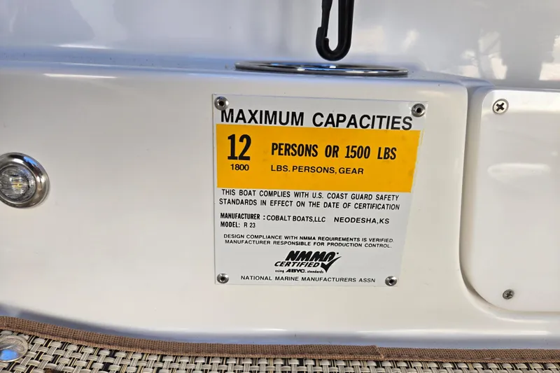 Slide: The Image of 2016 Cobalt R3 boat capacity label, maximum 12 persons or 1500 lbs, NMMA certified. - 61