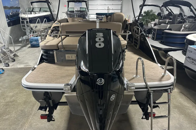Slide: The Image of 2023 Bennington 25LTSB pontoon boat with powerful 300 horsepower engine in showroom. - 3