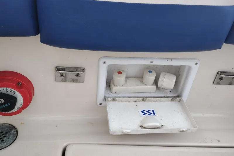 Slide: The Image of Control panel on a 1996 Crownline 250 CR boat with blue seating. - 22