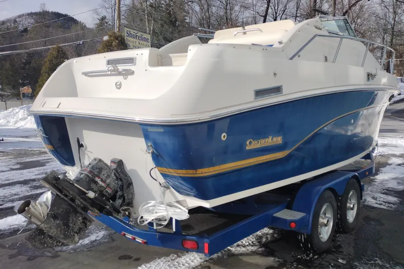 Slide: The Image of 1996 Crownline 250 CR boat on trailer, blue and white, parked in snowy area. - 5