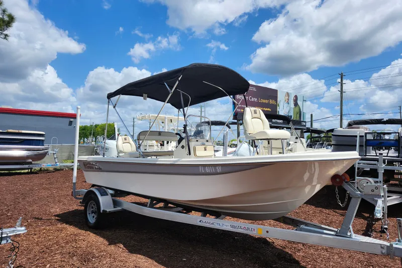 The Image of 2022 Carolina Skiff 178 JLS boat on trailer under blue sky. - 1