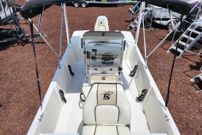Slide: The Image of 2022 Carolina Skiff 178 JLS boat interior with seating and steering console. - 12