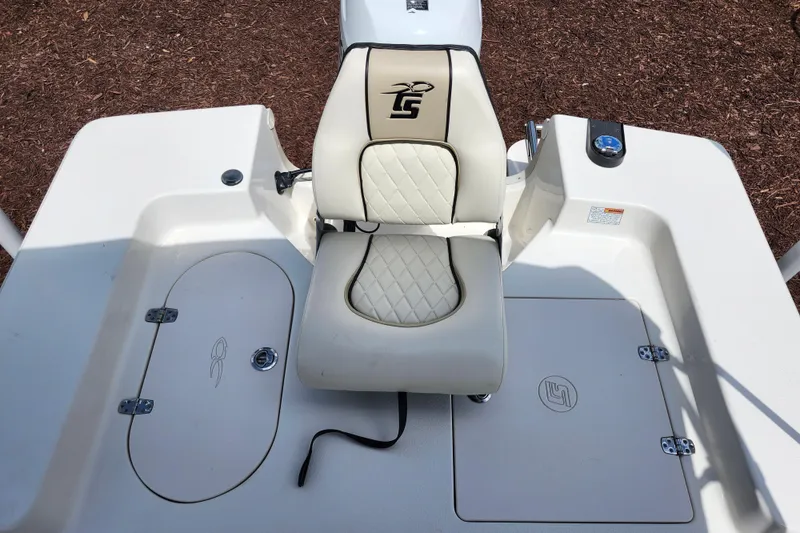Slide: The Image of 2022 Carolina Skiff 178 JLS boat seat with storage compartments and sleek design. - 14