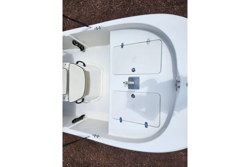 Slide: The Image of 2022 Carolina Skiff 178 JLS boat interior with storage compartments and seating. - 16