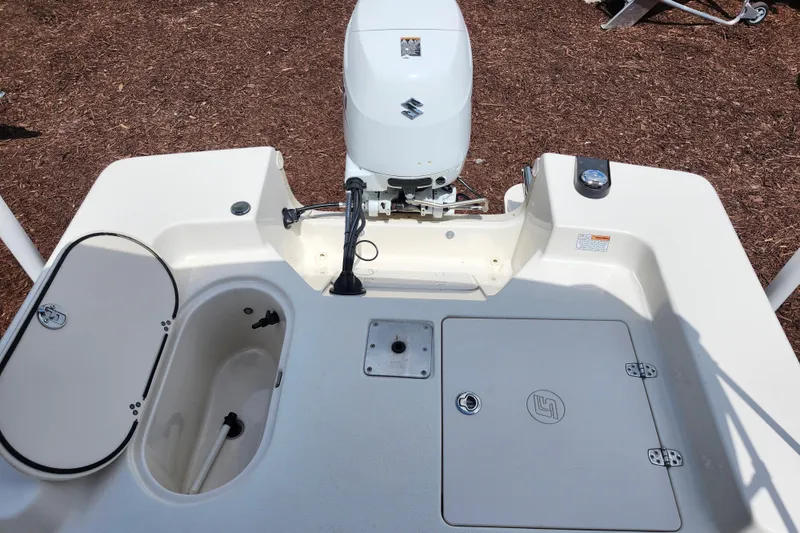 Slide: The Image of 2022 Carolina Skiff 178 JLS boat deck with Suzuki outboard motor. - 25