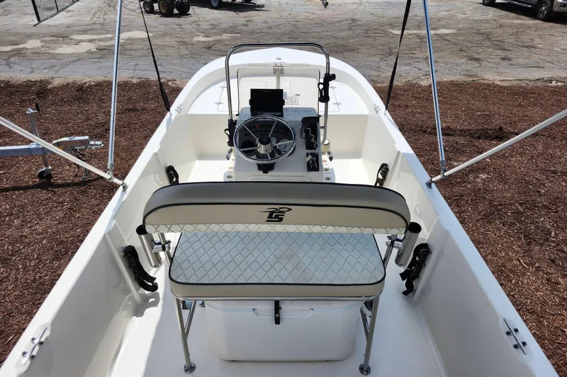 Slide: The Image of 2022 Carolina Skiff 178 JLS boat interior with steering console and seating. - 26