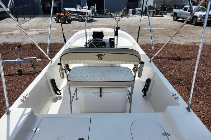 Slide: The Image of 2022 Carolina Skiff 178 JLS boat interior with seating and steering console. - 27