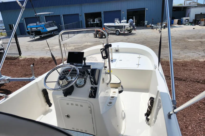 Slide: The Image of 2022 Carolina Skiff 178 JLS boat interior with steering console and gauges. - 29