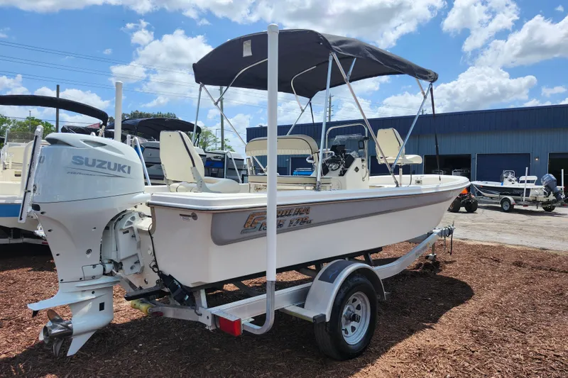 Slide: The Image of 2022 Carolina Skiff 178 JLS boat with Suzuki outboard motor on trailer. - 7