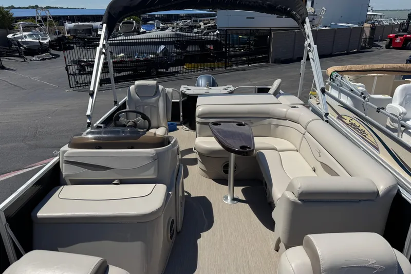 Slide: The Image of 2017 Bennington 22 SX Fish pontoon boat with spacious seating and modern design. - 11