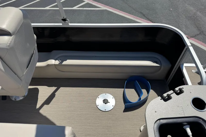 Slide: The Image of Interior view of a 2017 Bennington 22 SX Fish boat, featuring seating and deck details. - 7